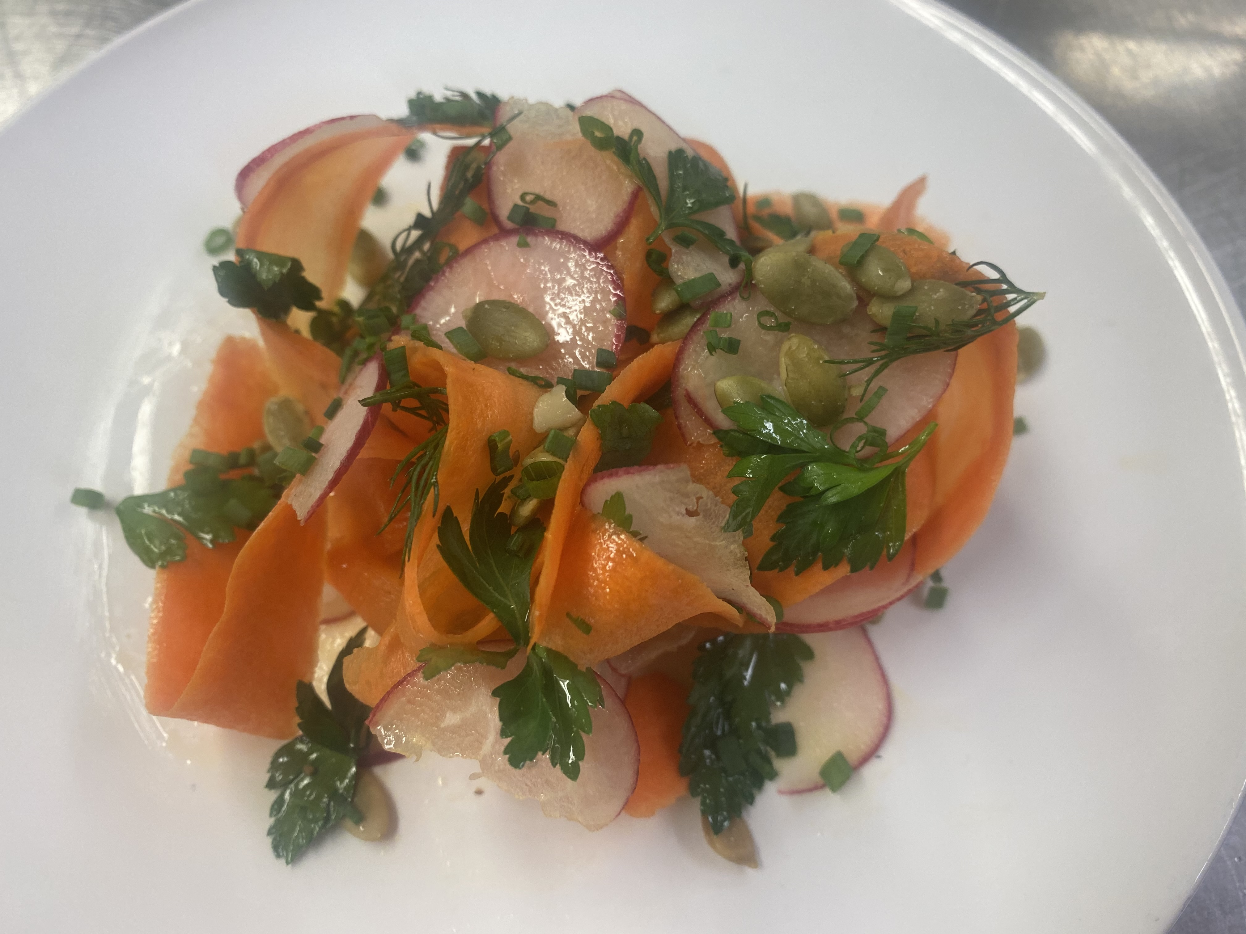 herb salad with radish and pupmkin seeds